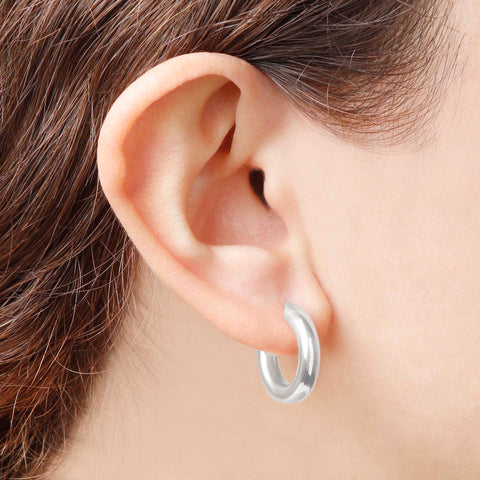 Italian Sterling Silver Rhodium 3/4" High-Polished Hoop Earrings in an ear