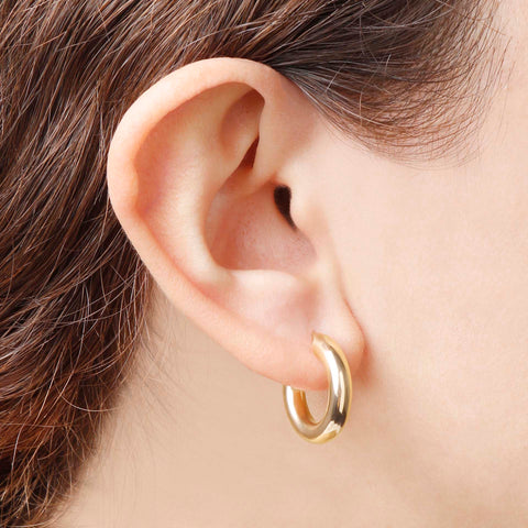 Italian Sterling Silver 18K Yellow Gold-Plate 3/4" High-Polished Hoop Earrings in an ear