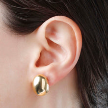 Load image into Gallery viewer, Bellissimo Bronzo Polished  18K Yellow Gold Plate Cabochon Earrings in an ear
